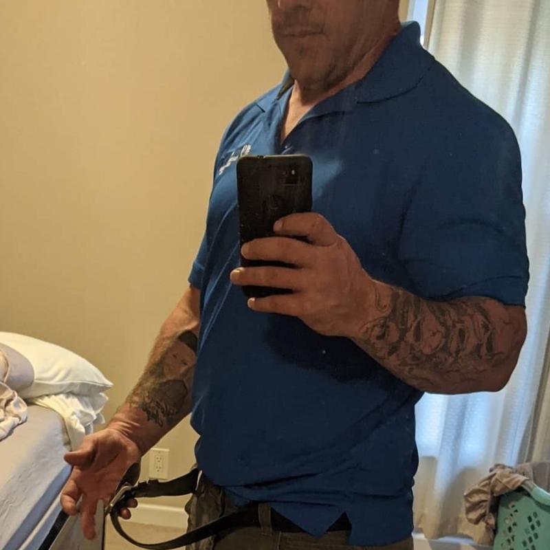 Colby taking a selfie wearing his pre-weight loss belt