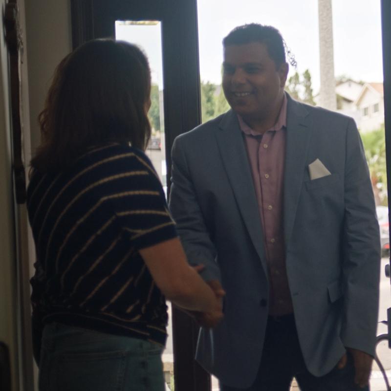 Erica shaking hands with Dr. Suliman