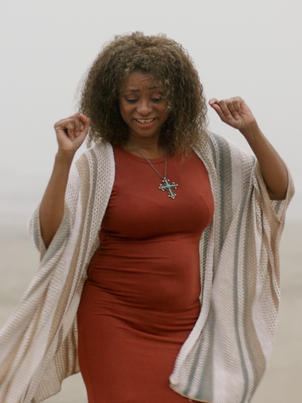 Eva dancing on the beach at dawn