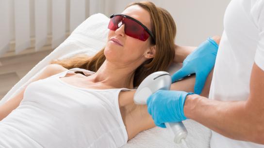 A Woman getting laser hair removal on her armpit