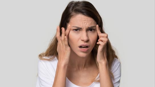 Woman examining age spots