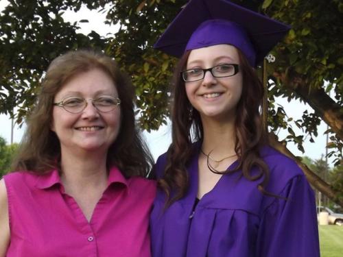 Angel in her graduation cap and gown with her mother